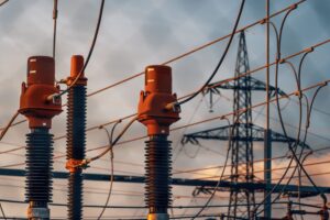 High-voltage substation equipment at dusk, symbolizing OT network visibility gaps in grid infrastructure