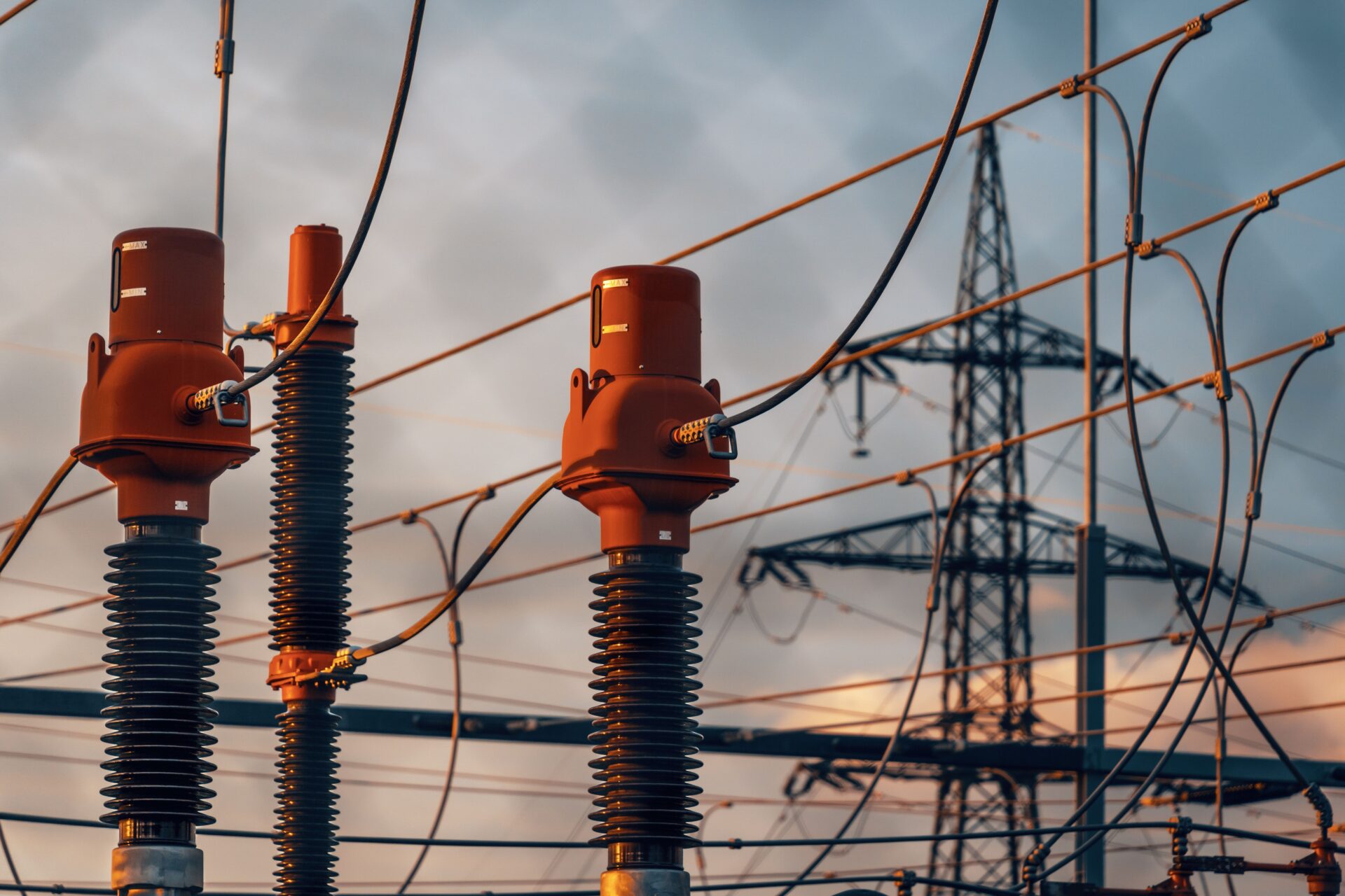 High-voltage substation equipment at dusk, symbolizing OT network visibility gaps in grid infrastructure