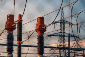 High-voltage substation equipment at dusk, symbolizing OT network visibility gaps in grid infrastructure